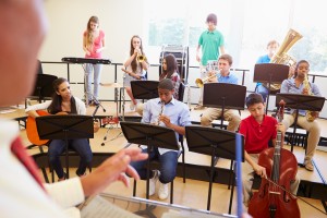 Children playing instruments in music class