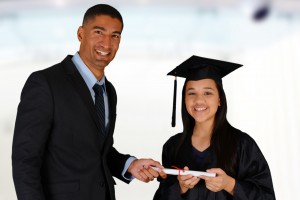 Principal gives a student her diploma