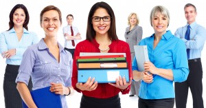 School administrators and principal holding books