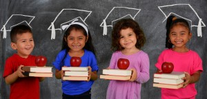 Schoolgirls holding books and apples