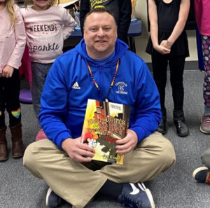 Principal helping in classroom