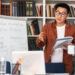 A teacher conducts online classes indoors, adapting teaching degree programs to match current education policies.