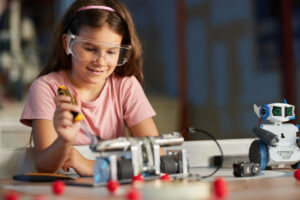 young student working on robot